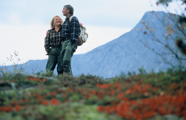 Couple outside picking berries together in Northern Norway© Terje Rakke